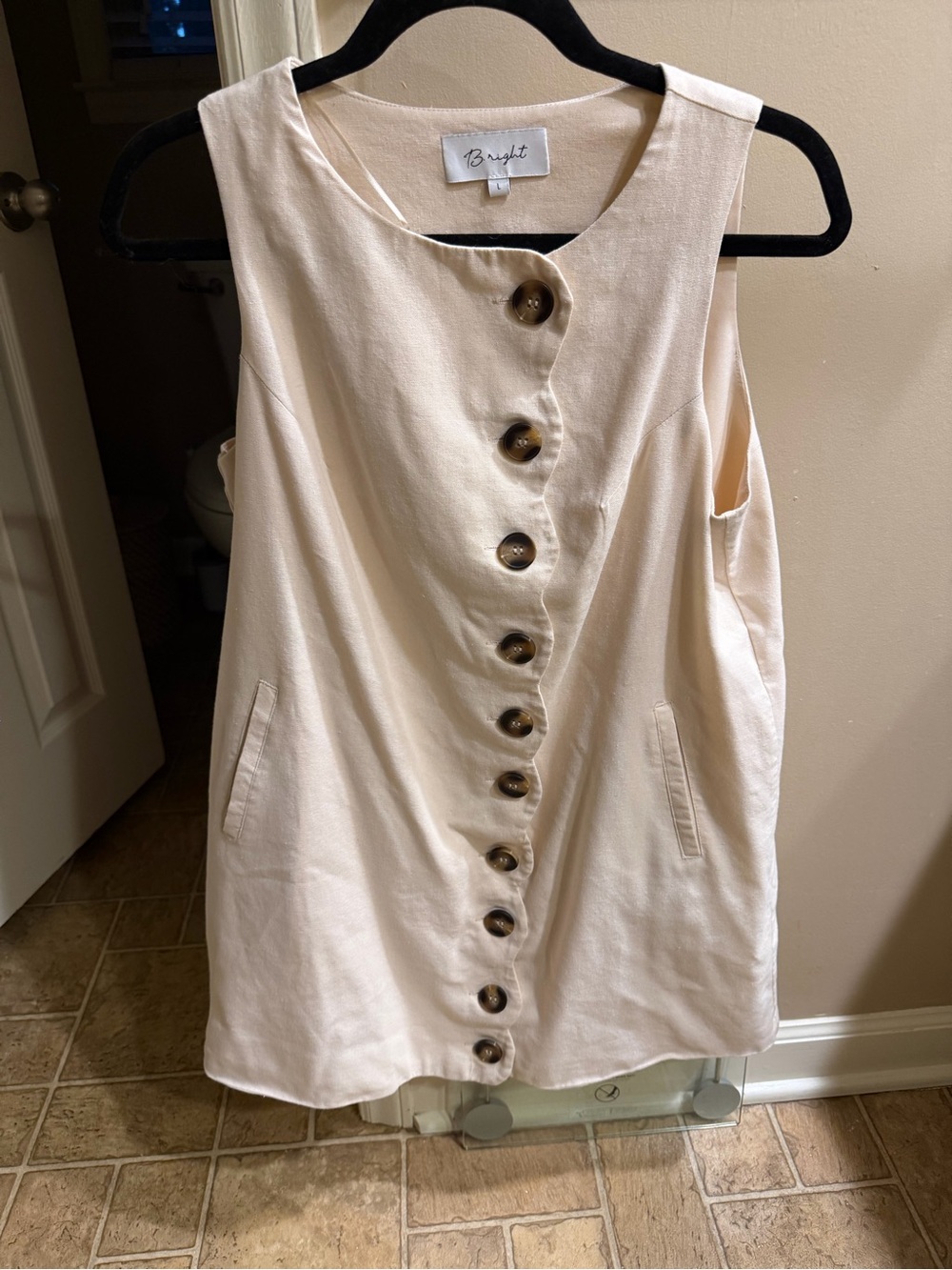 Cream Button-Front Sleeveless Tunic with Pockets